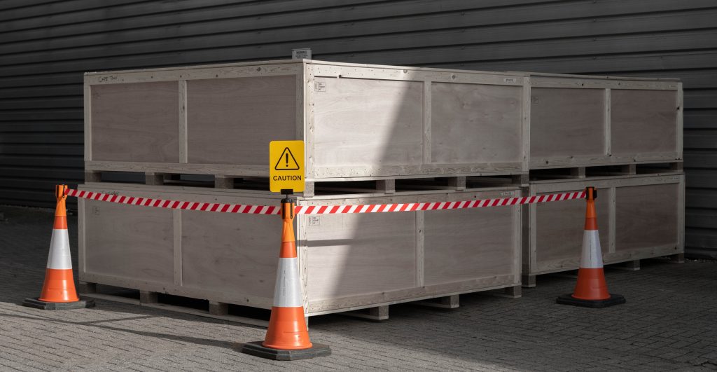 3 traffic cones with the Tensacone Topper attached, customised using red and white chevron webbing with a sign holder.